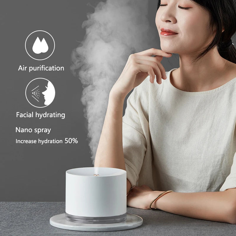 Portable USB rechargeable 2000mAh air humidifier and night light diffuser.